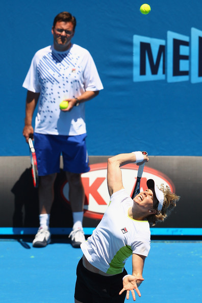 Carl Maes watching Kim Clijsters serve at the Australian Open