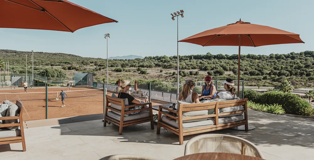 Clay tennis courts and terrace at La Reserva Club, Sotogrande