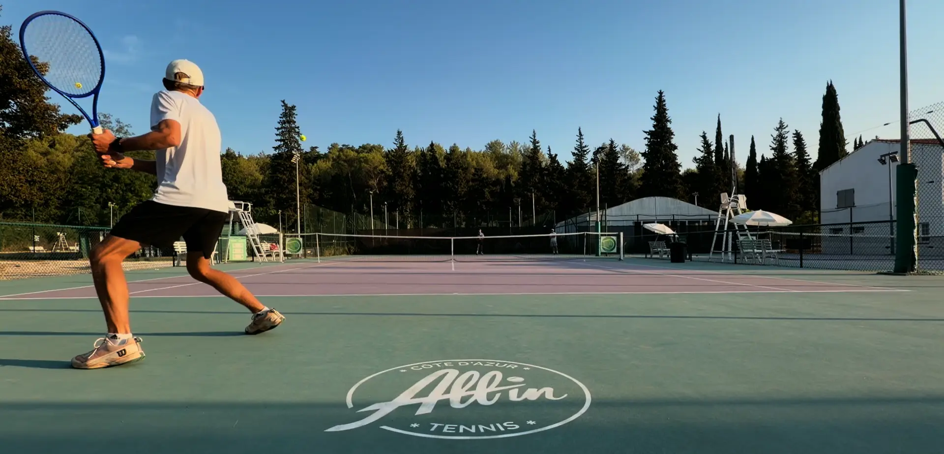 Players competing on court at the Tsonga Academy in France